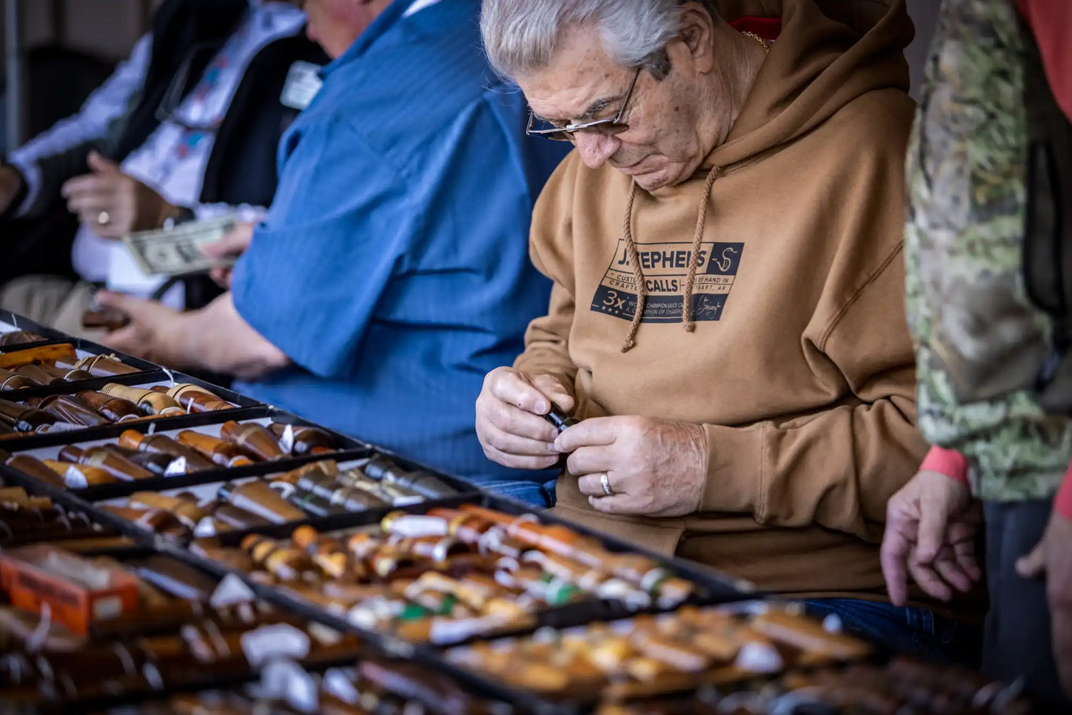 An assortment of various knives displayed in trays.