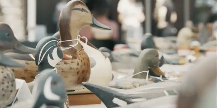 A collection of intricately carved wooden duck decoys.