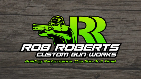 A custom gun works logo featuring a shooter with a double-barreled shotgun.