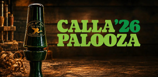 Dark green, glossy plastic duck call with a gold logo and text reading ’rich n’ toot duck call’ and ’stuttgart, al.’