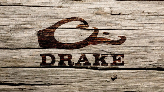 A wooden plaque with a stylized duck head and the word ’DRAKE’ carved into it.